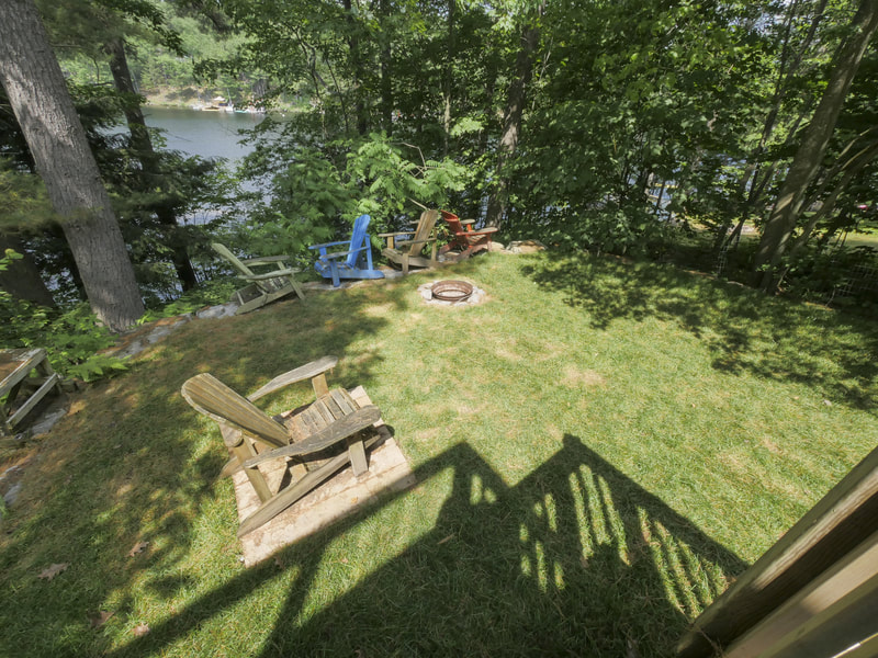 3395 Flat Rapids waterside fire pit with view of Severn River